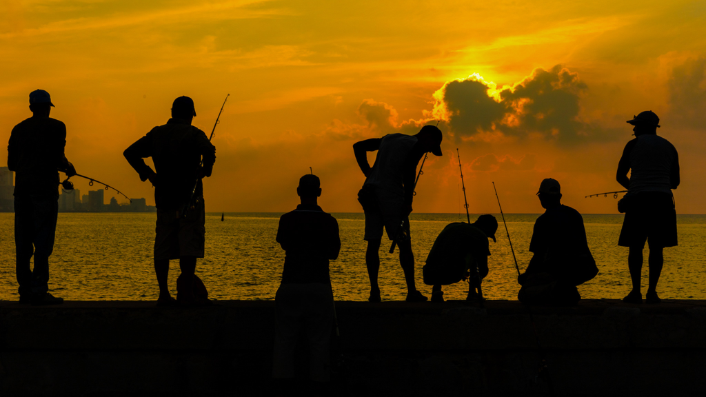 A Havana Malecón sunset photography story from 2017 — seven silhouetted fishermen, one perfect evening light, and why some images you don't plan.